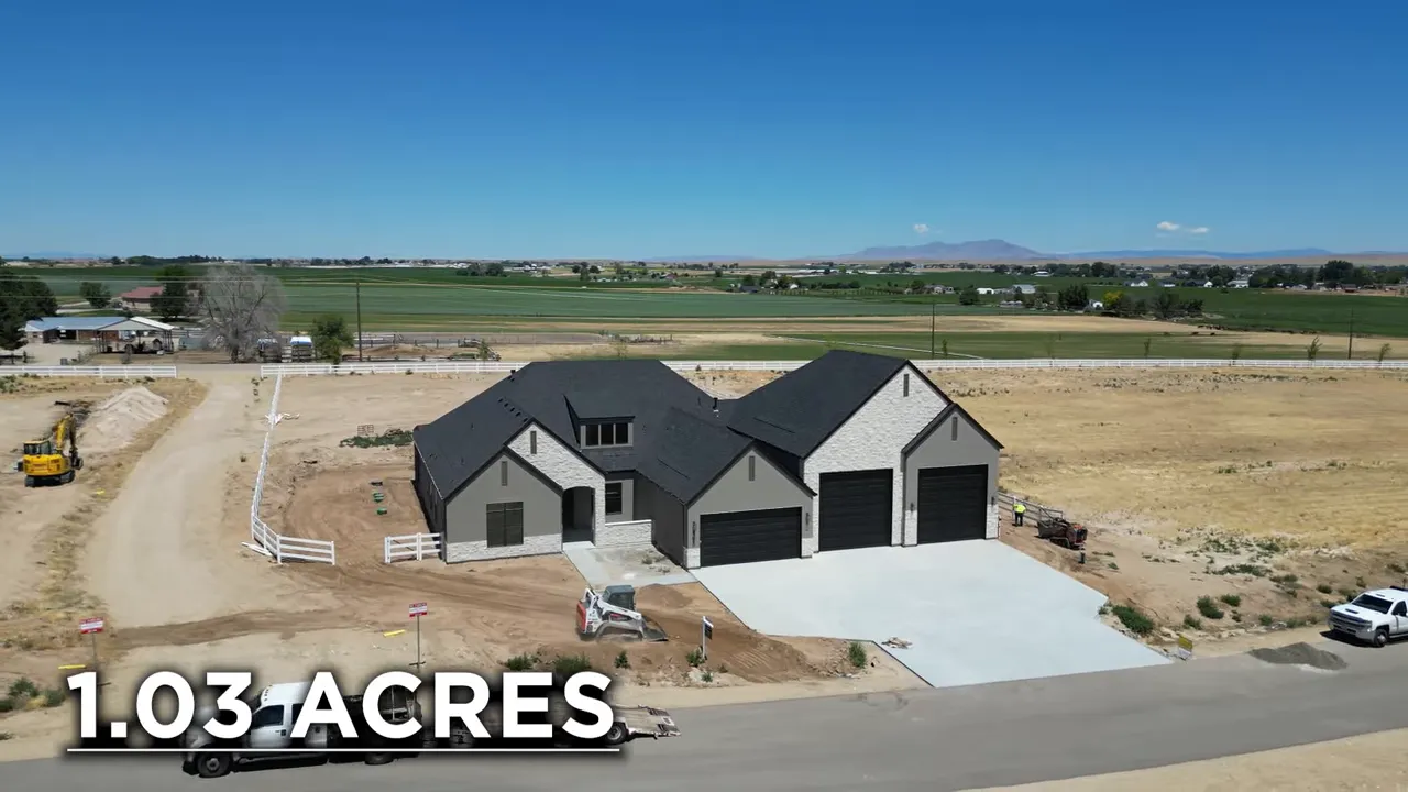 Aerial view of the house on acreage with text showing 1.03 acres