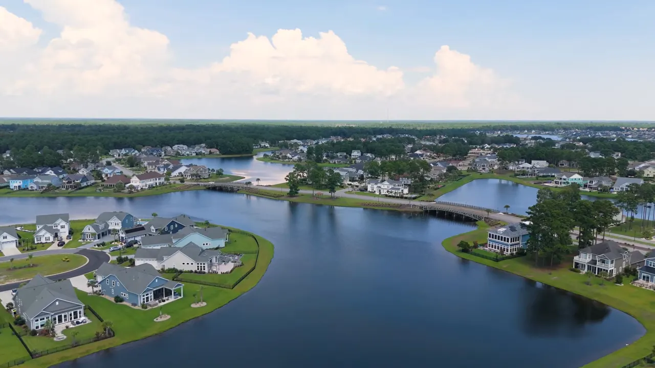 Aerial view of large lake surrounded by homes