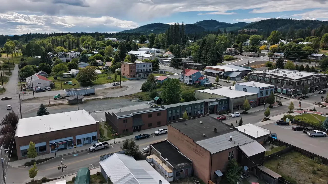 Aerial view of downtown Priest River with shops and streets