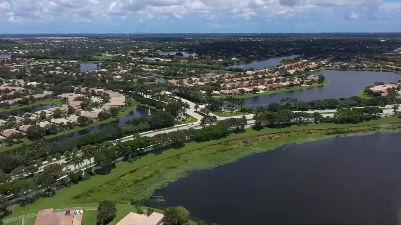 Aerial view of lakefront active adult community neighborhoods in West Lake Worth Florida