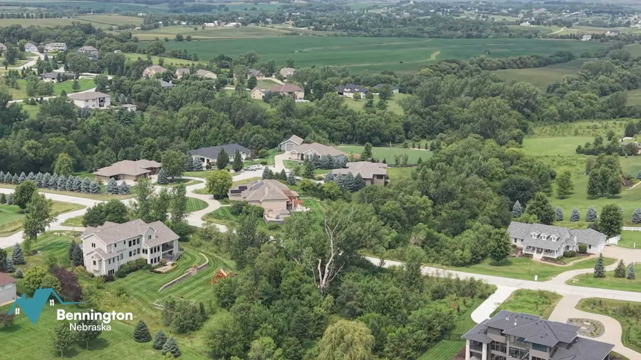 Aerial view of large homes on spacious green acreage lots near Bennington