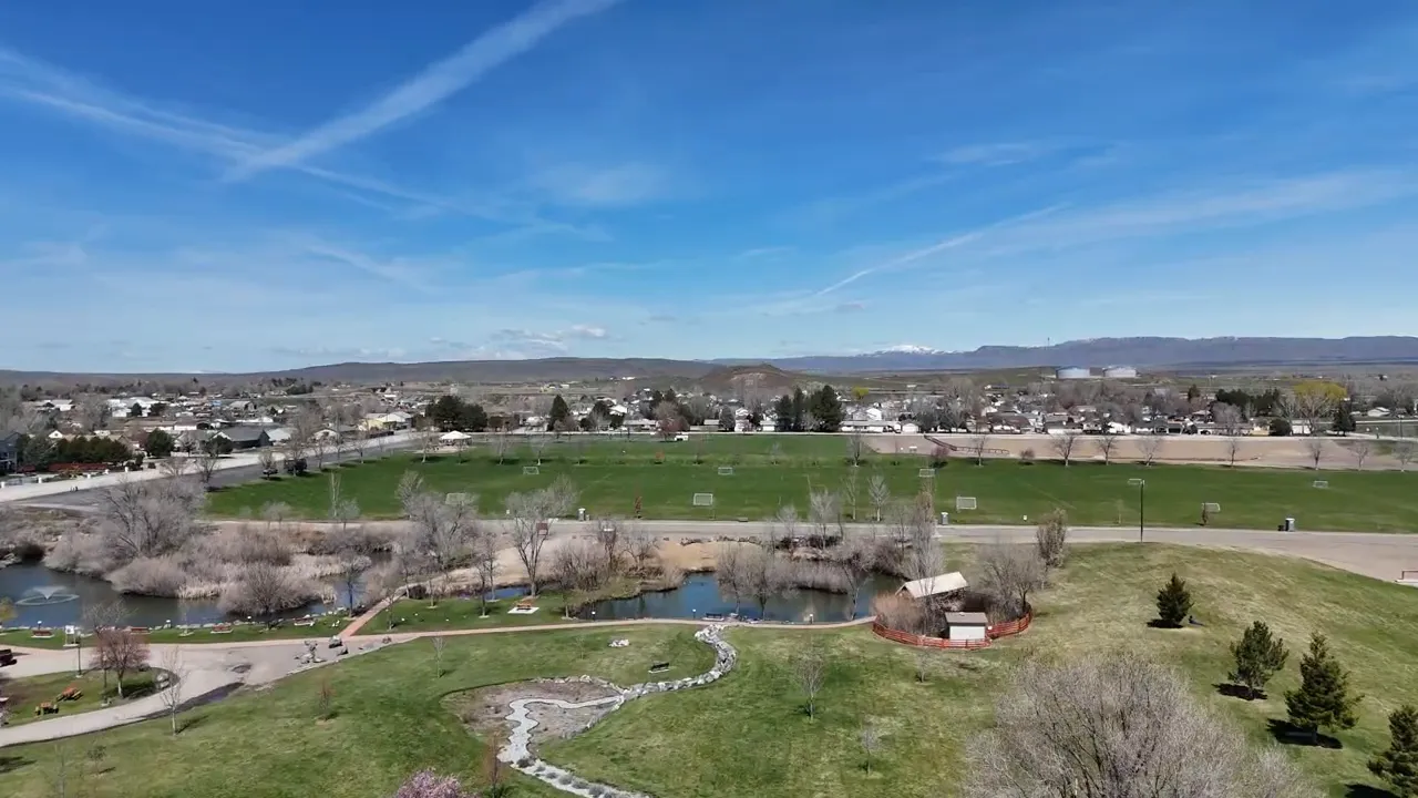 Aerial view of green space, pond area, and homes in Mountain Home Idaho