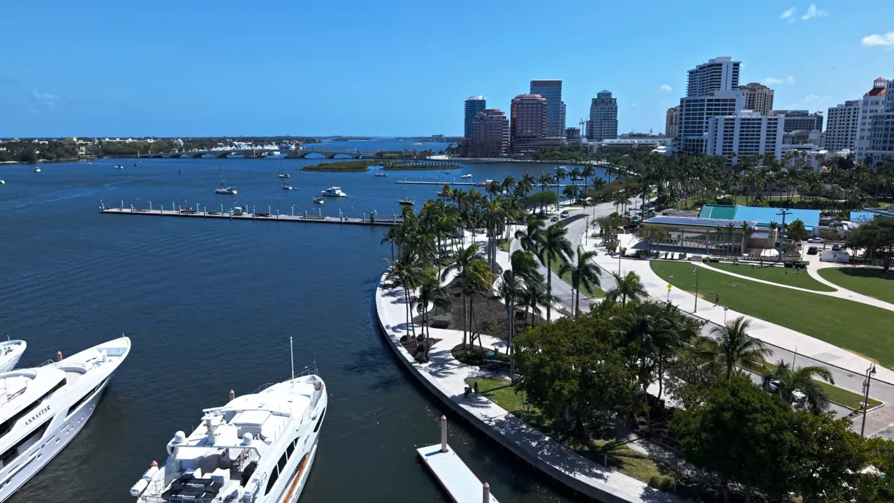 Aerial view of boats and the waterfront marina with downtown West Palm Beach buildings in the background