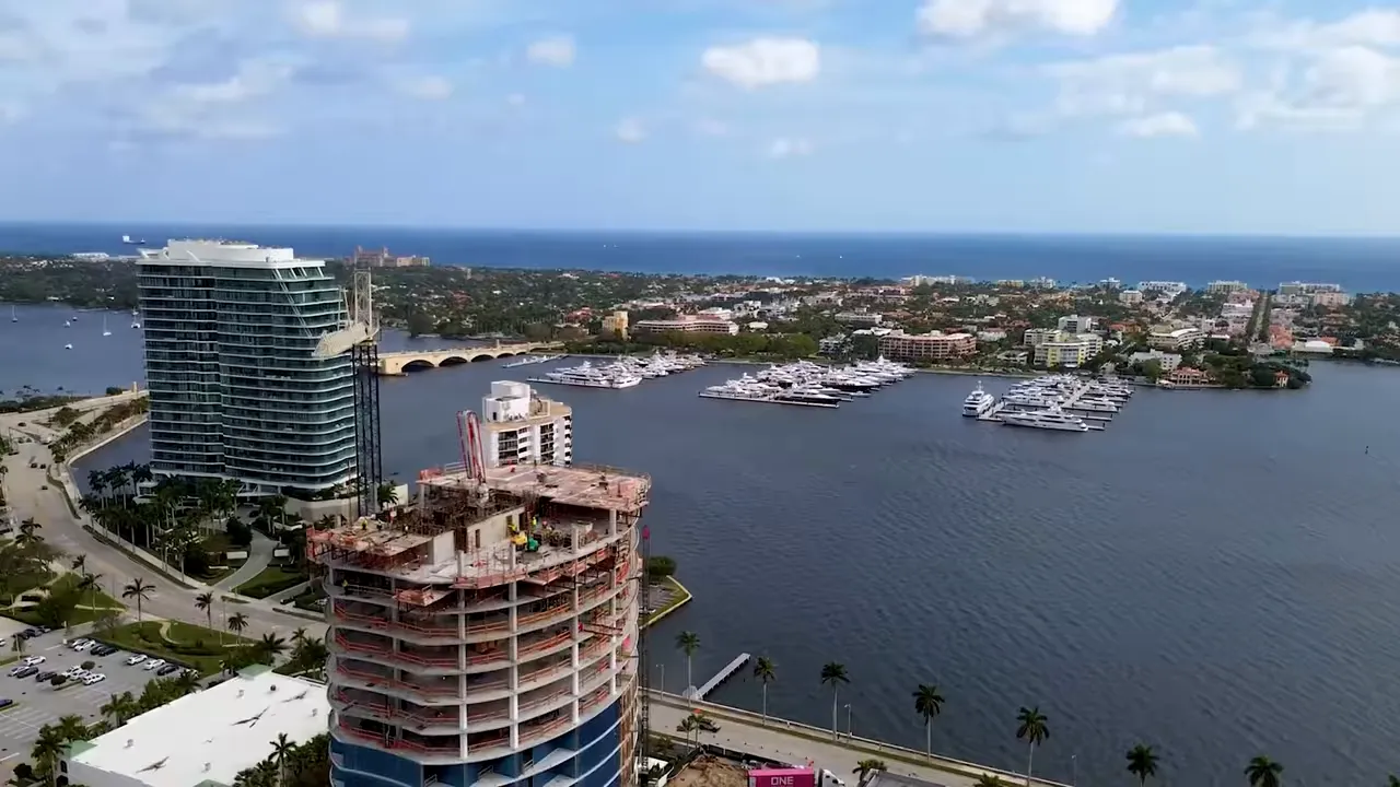 Aerial view of West Palm Beach waterfront with construction and marina