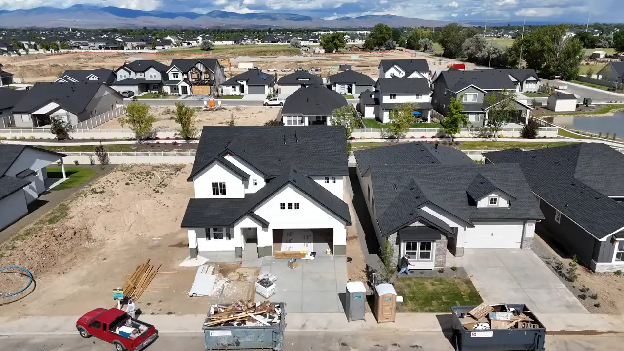 Aerial view of a nearly finished new construction neighborhood in Meridian, Idaho with landscaping and materials