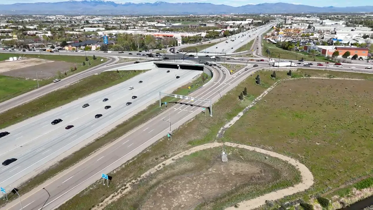 Aerial view of highway interchange with vehicles indicating congestion near Meridian and Boise
