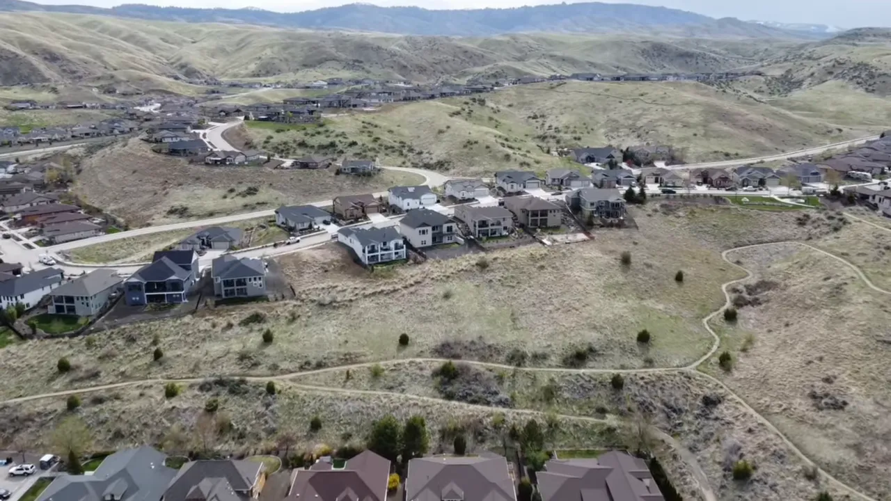 Landscaped yard and privacy fencing overlooking a view