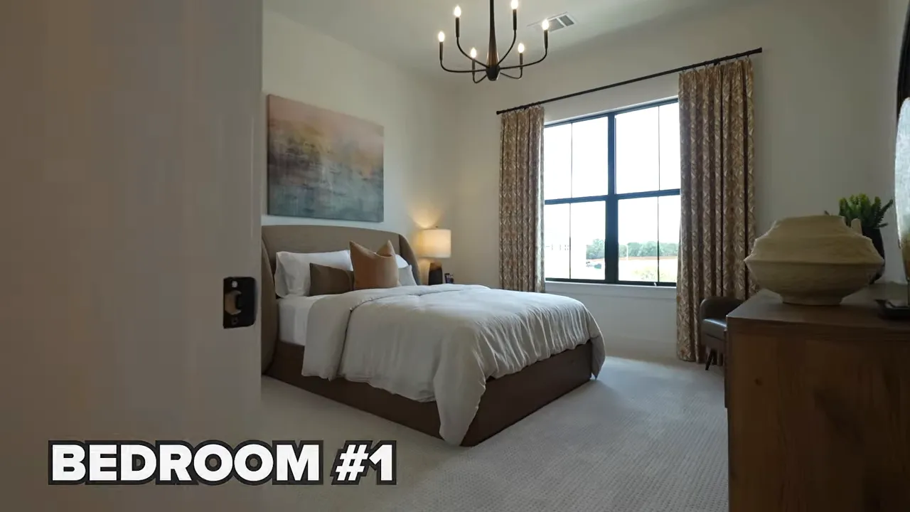 Bedroom with bed chandelier window and side table