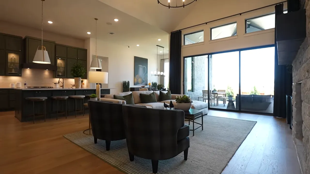 Open living room with chandelier fireplace seating and large sliding doors