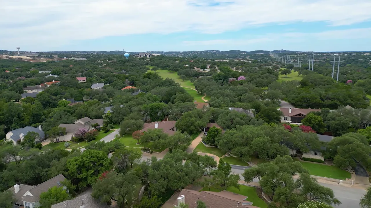 Aerial view of Lakeway TX neighborhoods and green spaces