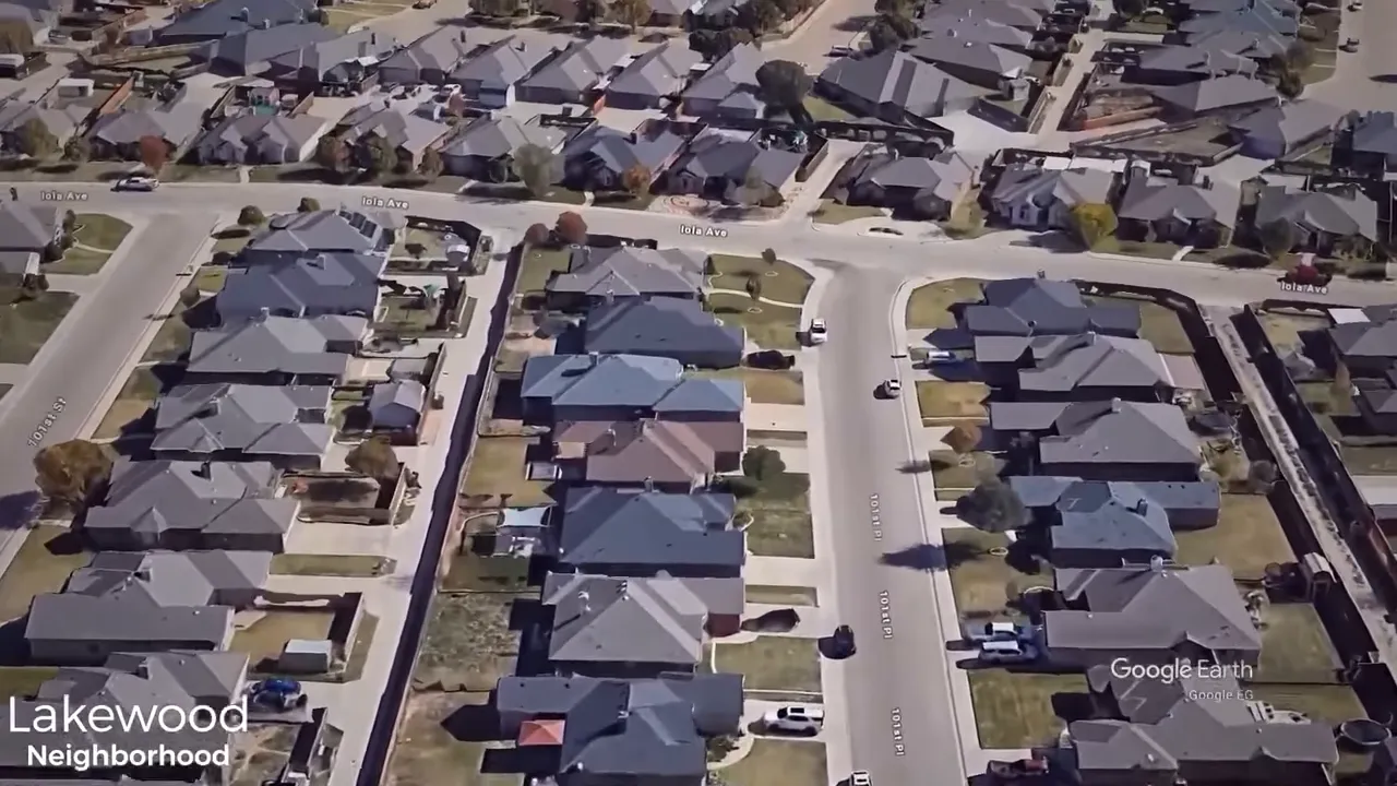 Neighborhood street view — quiet southern neighborhood with trees and yards