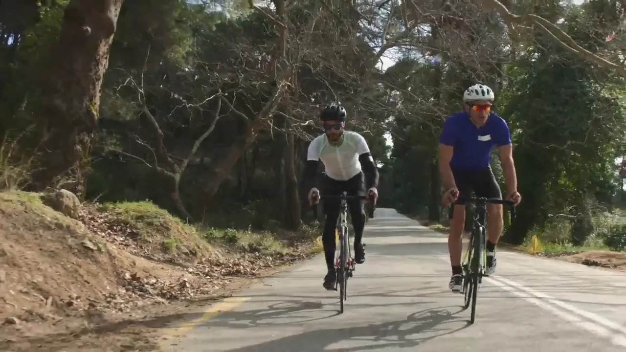 Cyclists riding on a scenic road near Castle Rock, Colorado