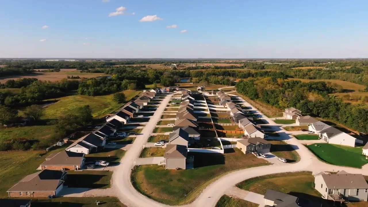 High-resolution drone aerial of Meadow Creek subdivision clearly showing gravel roads and house placement