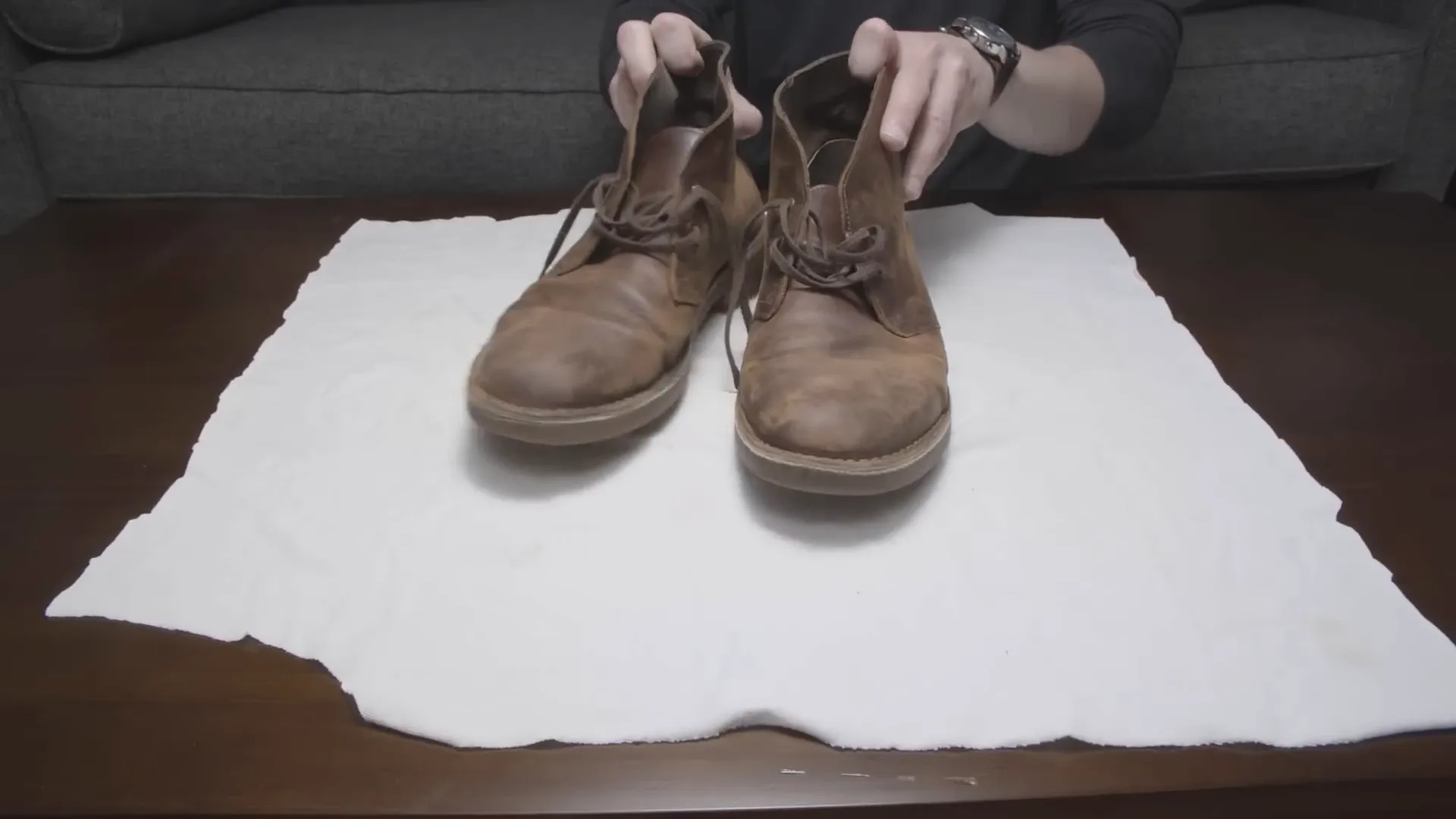 Workspace setup with newspaper and laces removed