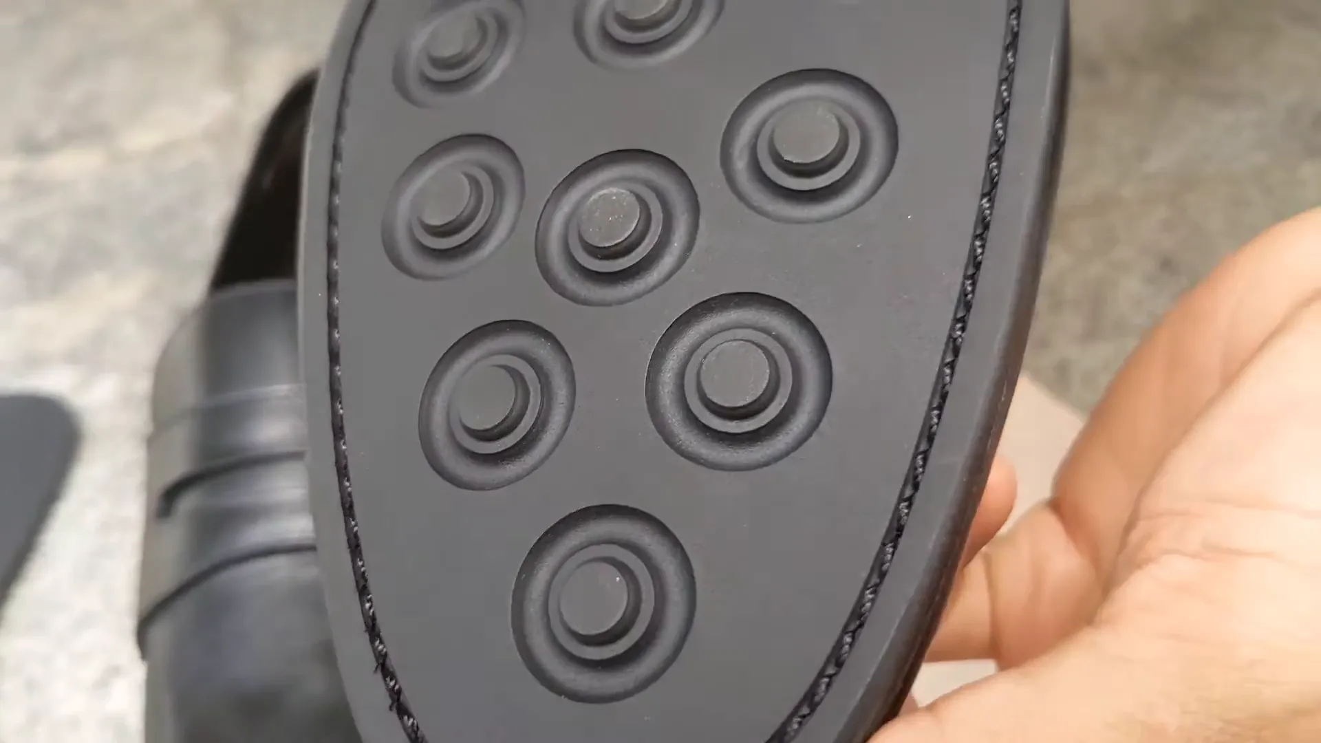 Close-up of a grooved rubber outsole showcasing traction
