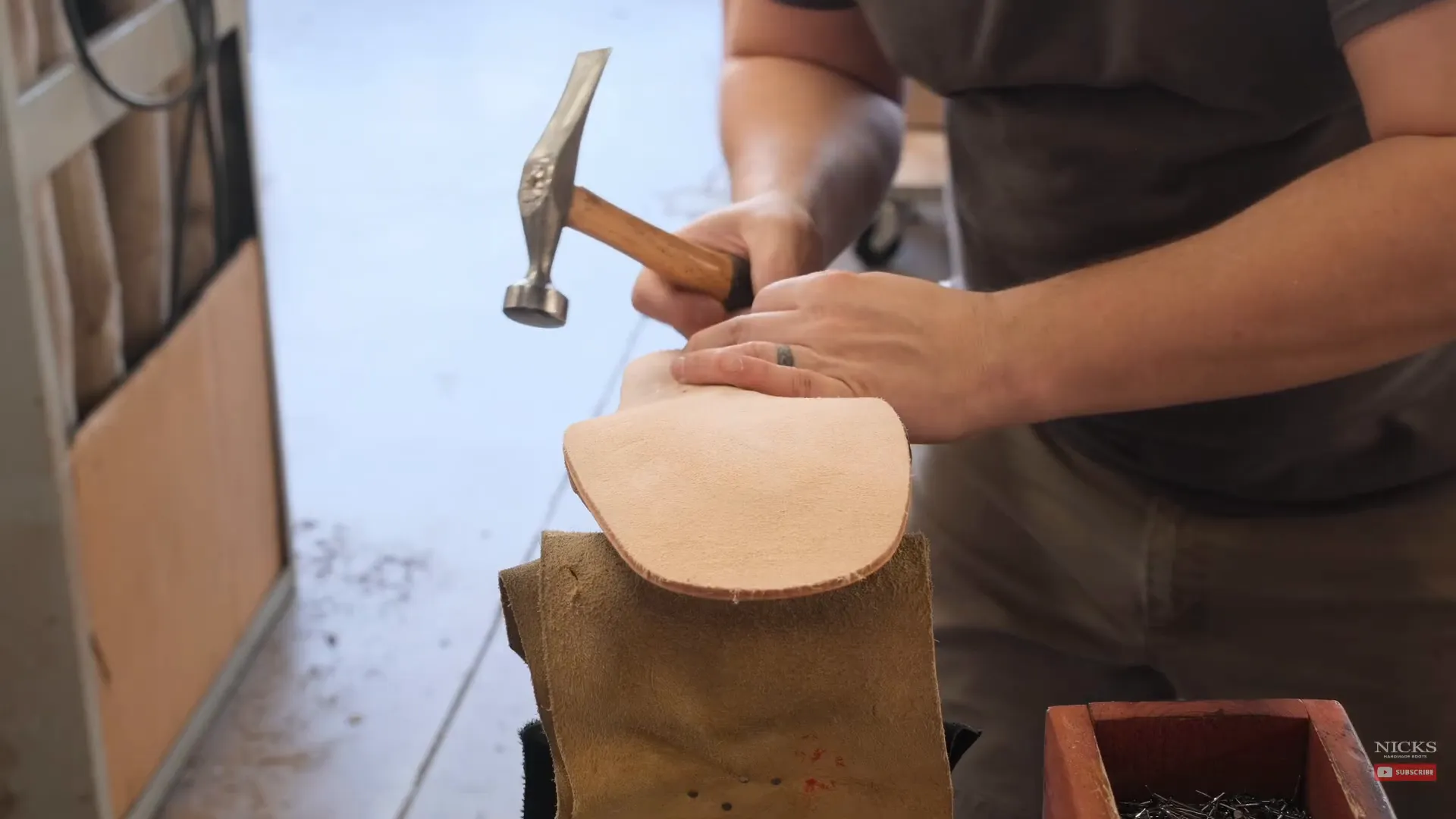 Hammering the midsole onto the boot