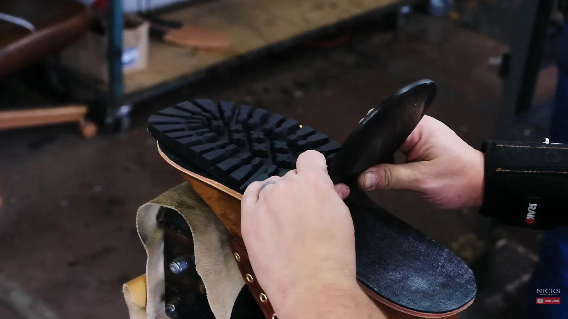 Applying the rubber outsole to the boot