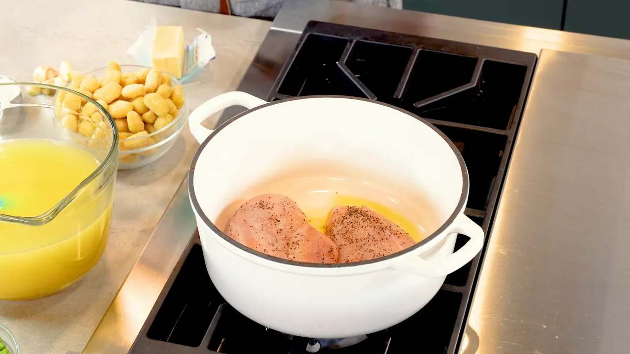 Chicken breasts searing in a pot