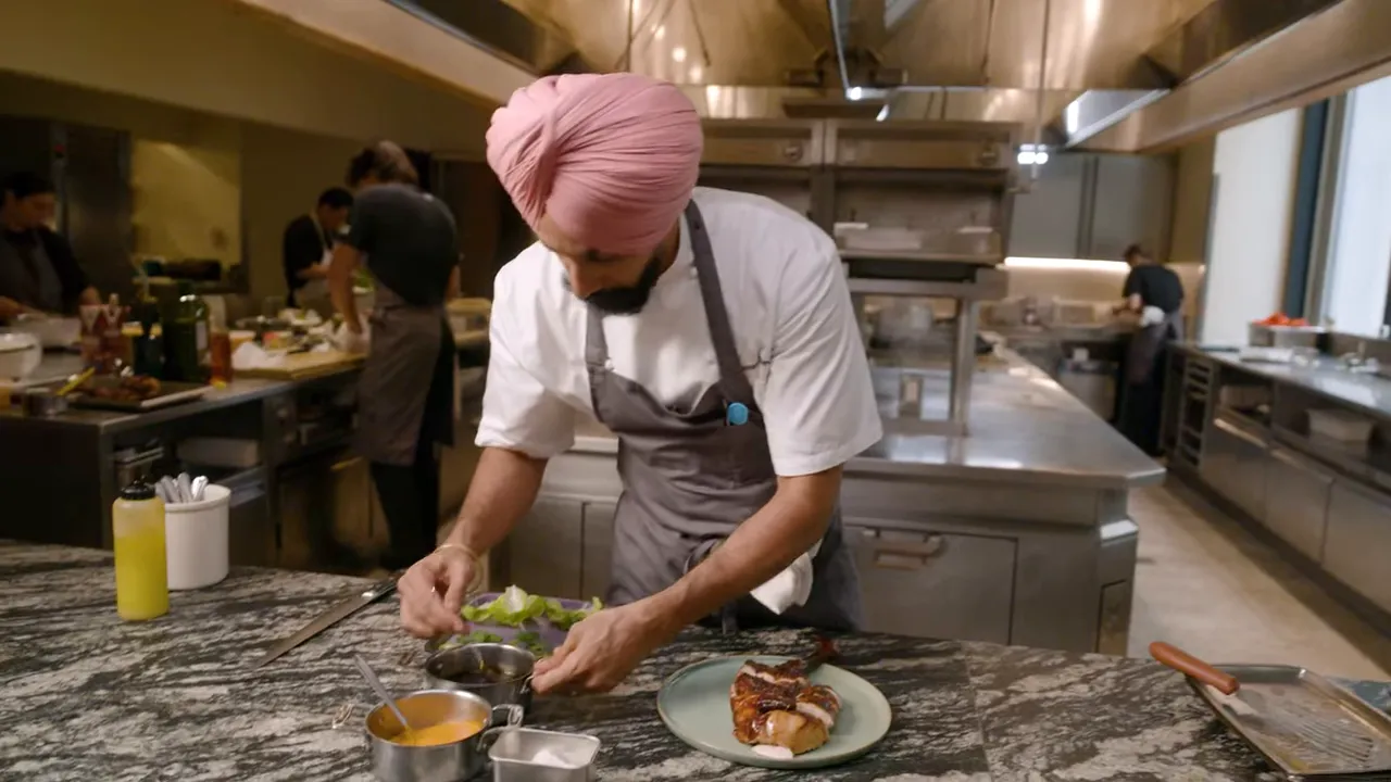 Plated Crown Chai roast chicken with salad and hot sauce