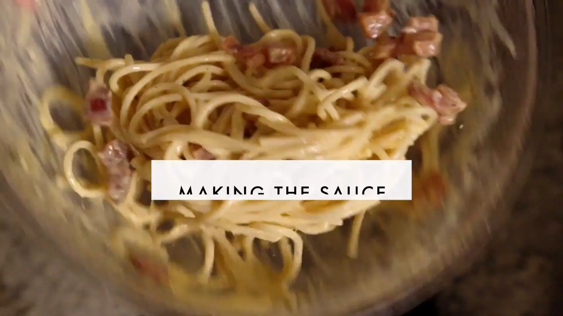 Mixing eggs, cheeses, pepper, and guanciale fat to make carbonara sauce