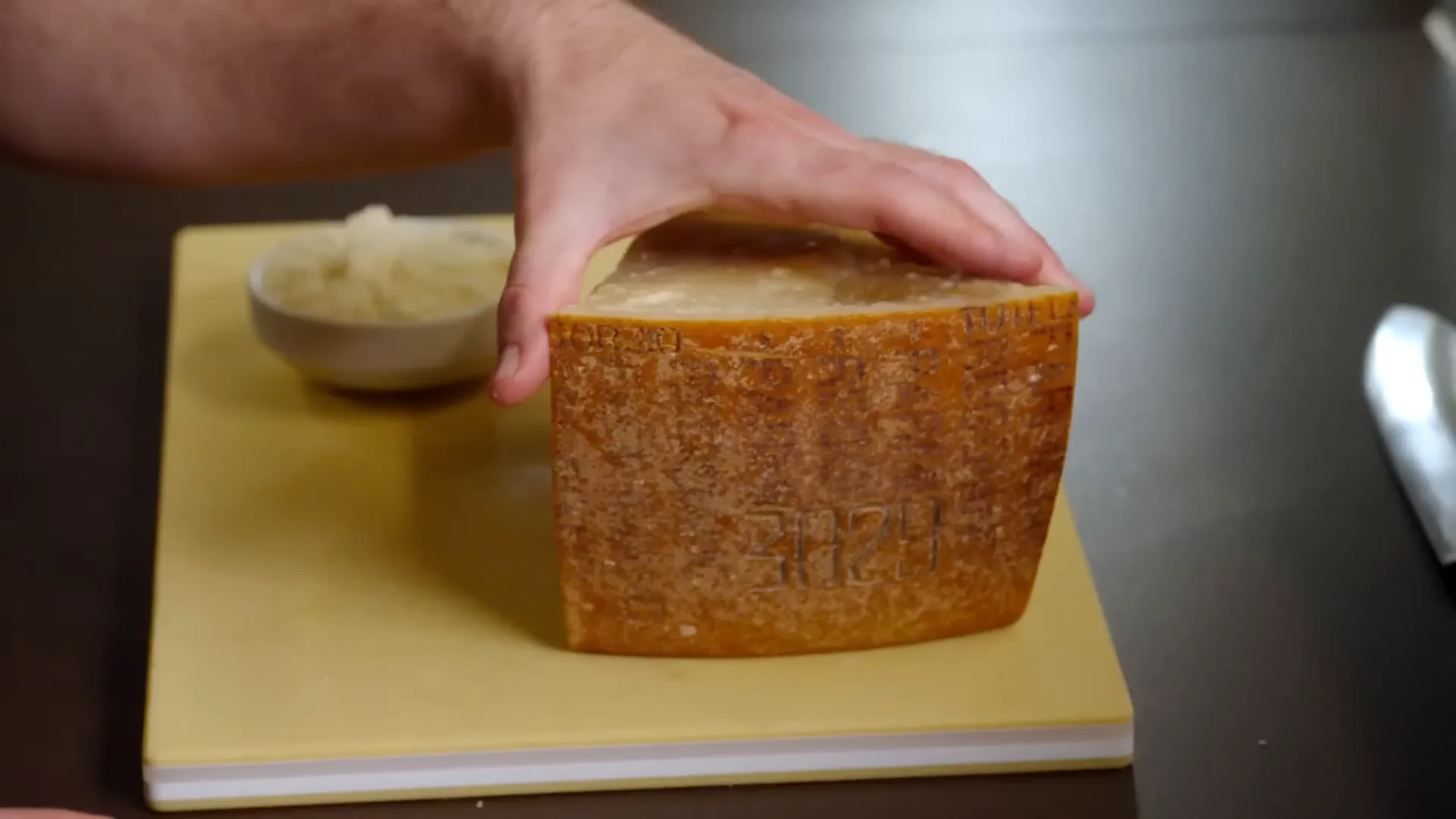 Grated Parmigiano Reggiano cheese ready for the pasta