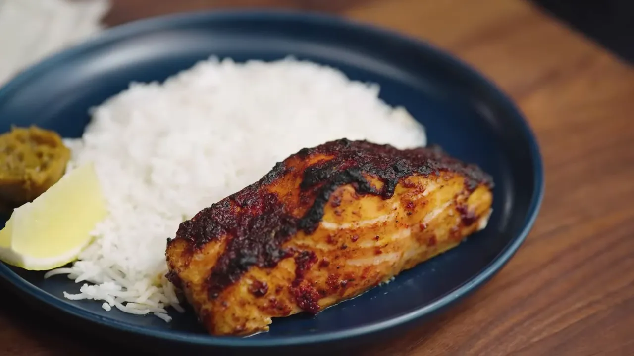 Tandoori salmon with charred crust and bright red color
