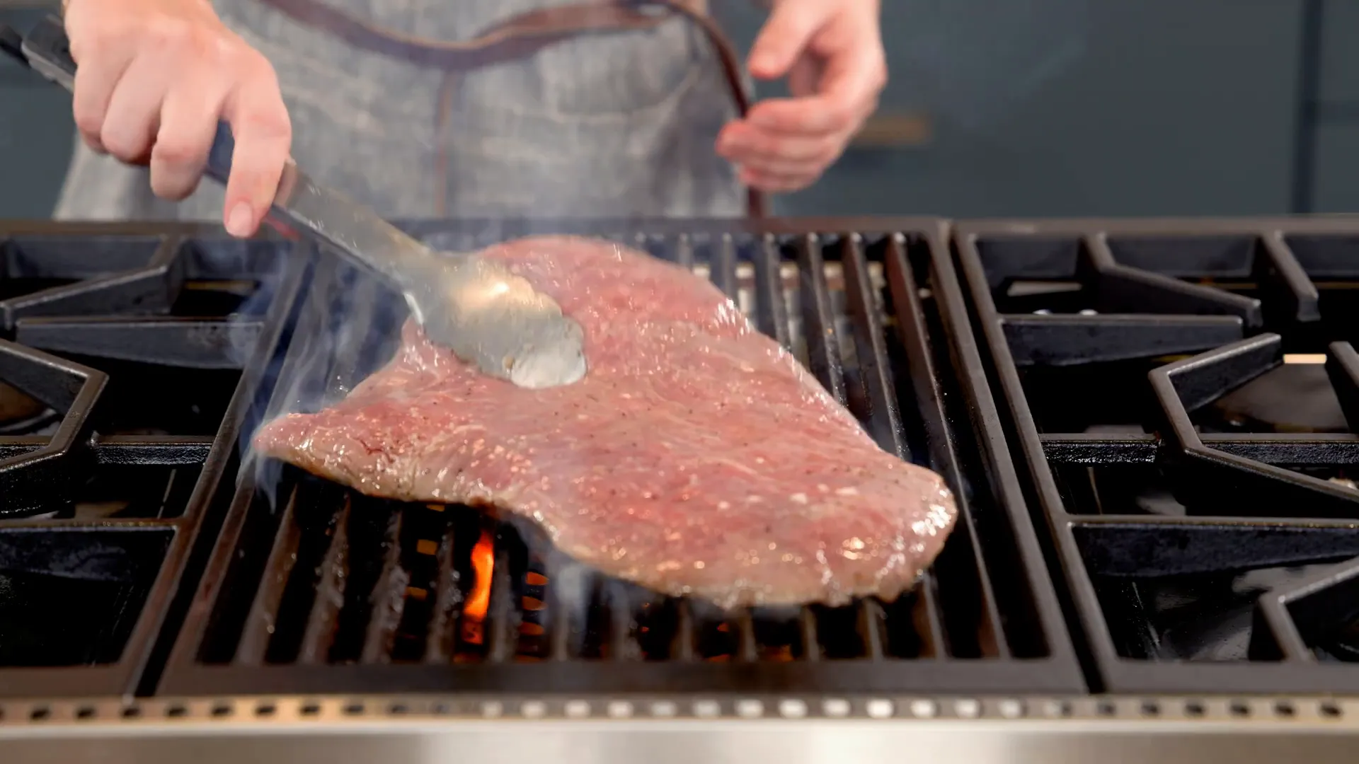 Grilling steak on a hot cast iron skillet