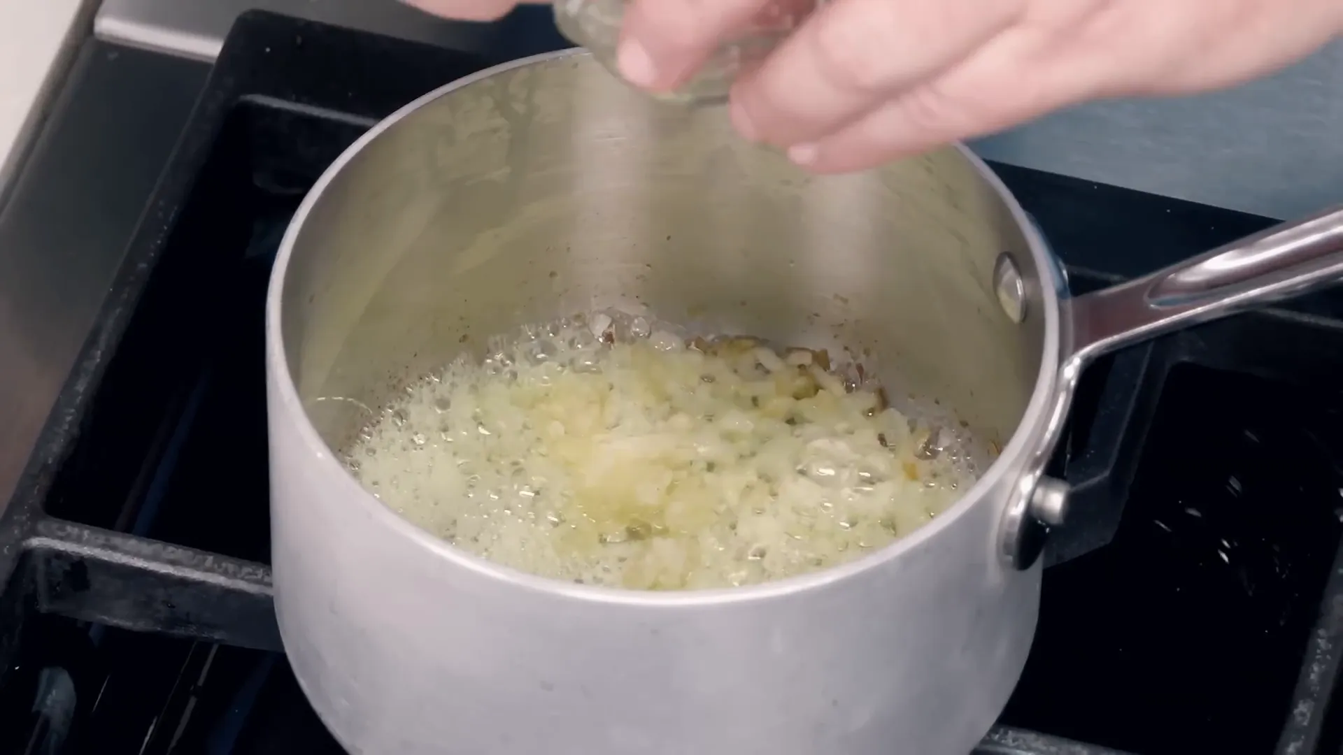 Cooking onions and garlic for tomato sauce