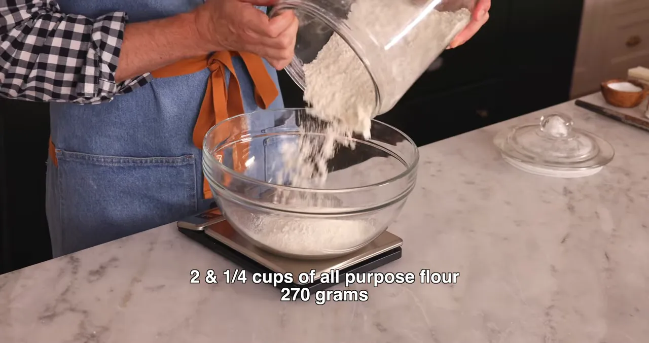 Measuring flour and dry ingredients in a large bowl