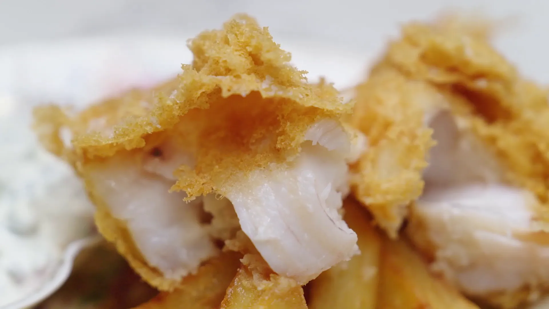 Light and airy fish and chips with crispy potatoes and tartar sauce