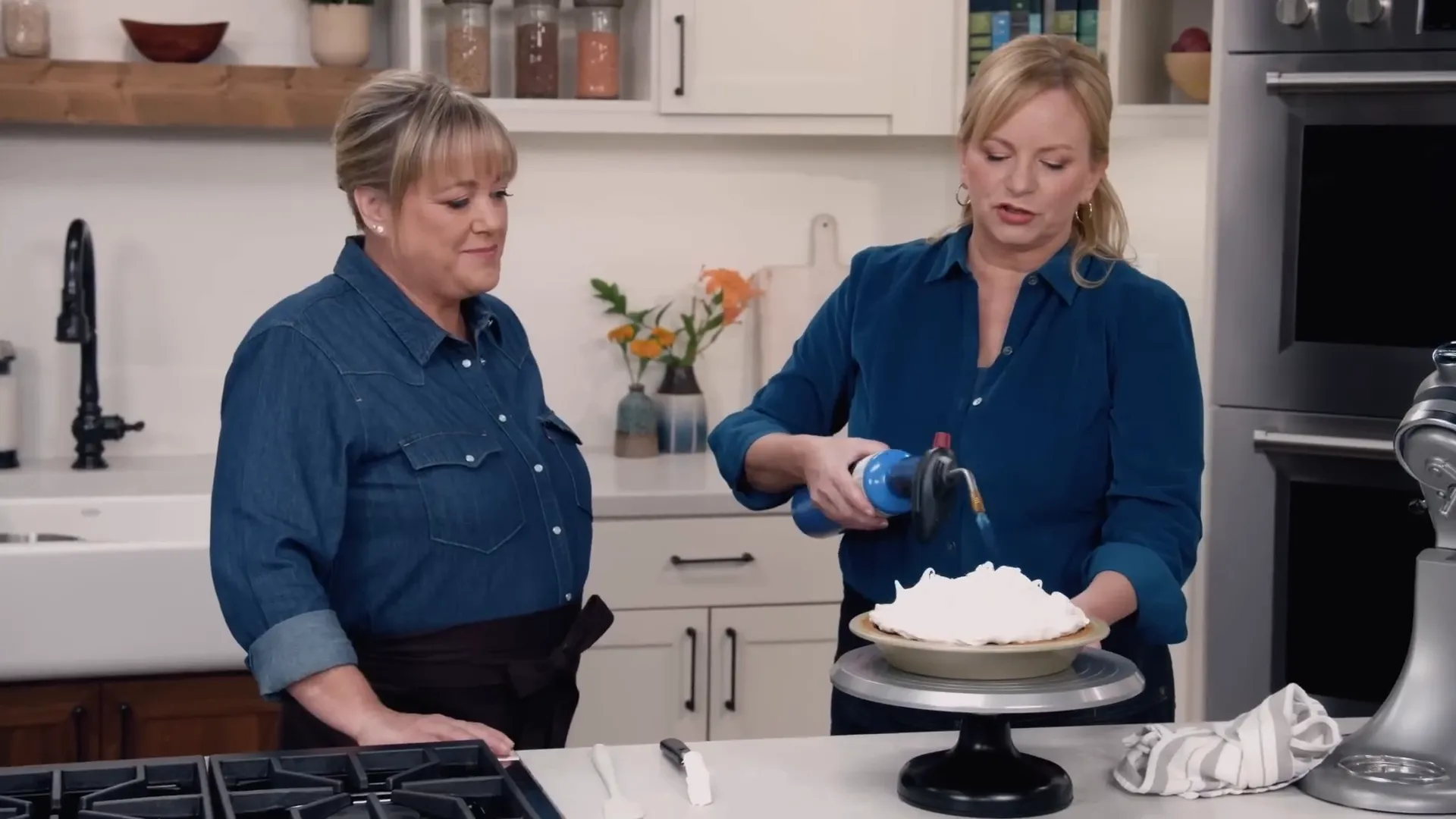 Toasting meringue topping with a kitchen blow torch