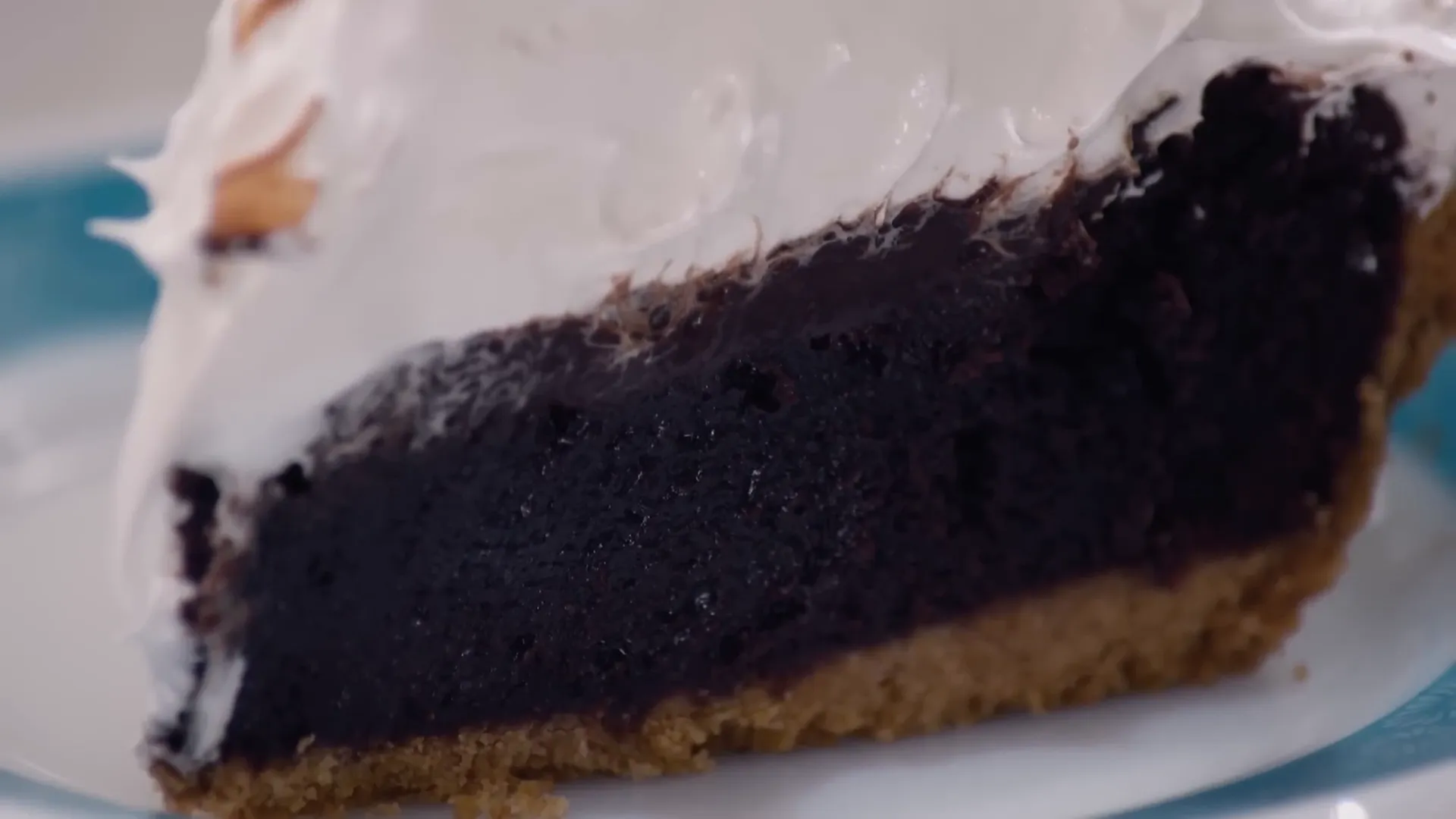 Slice of finished s'mores pie with toasted meringue topping