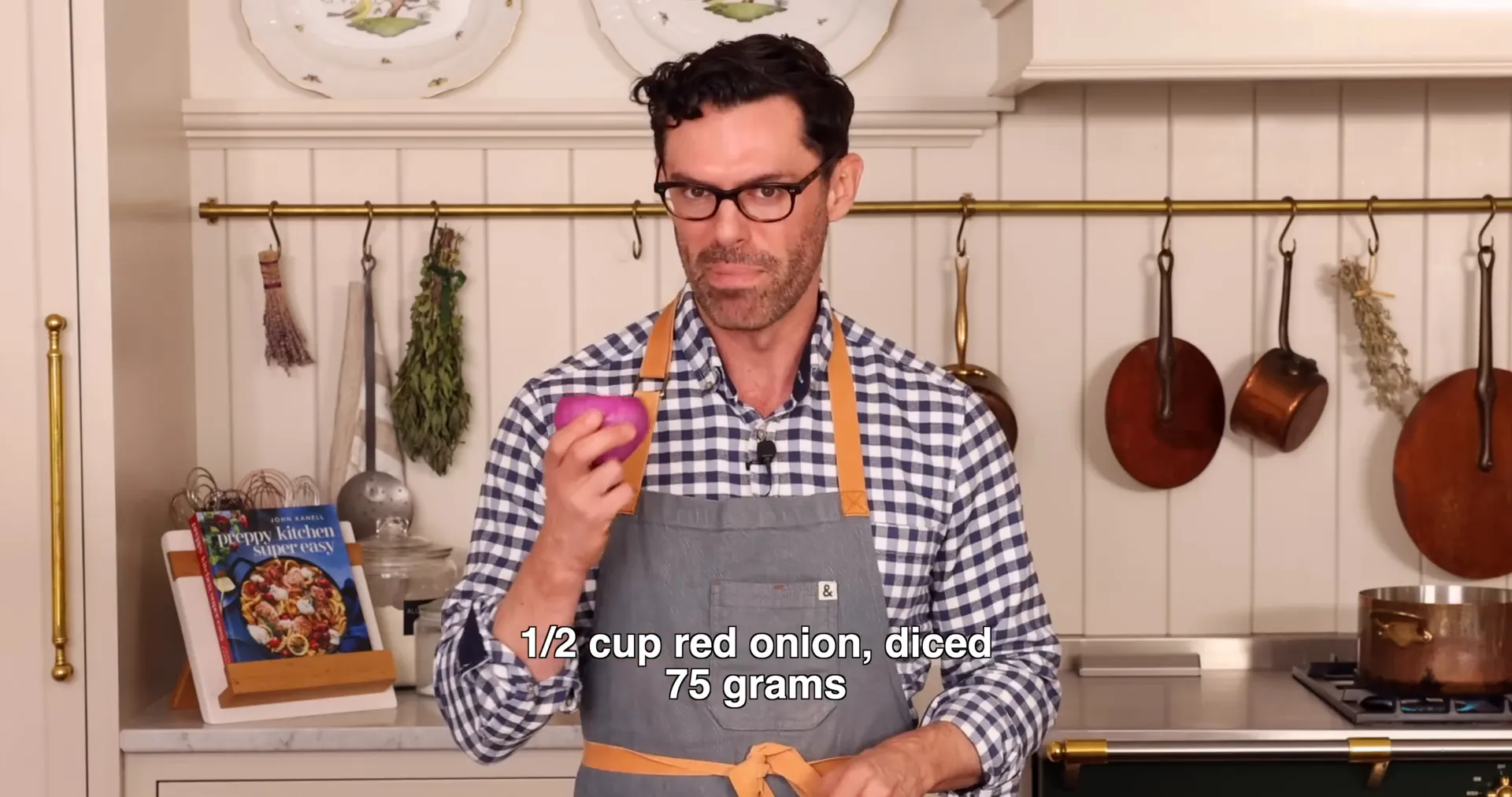 Chopped celery, herbs, and red onion on cutting board