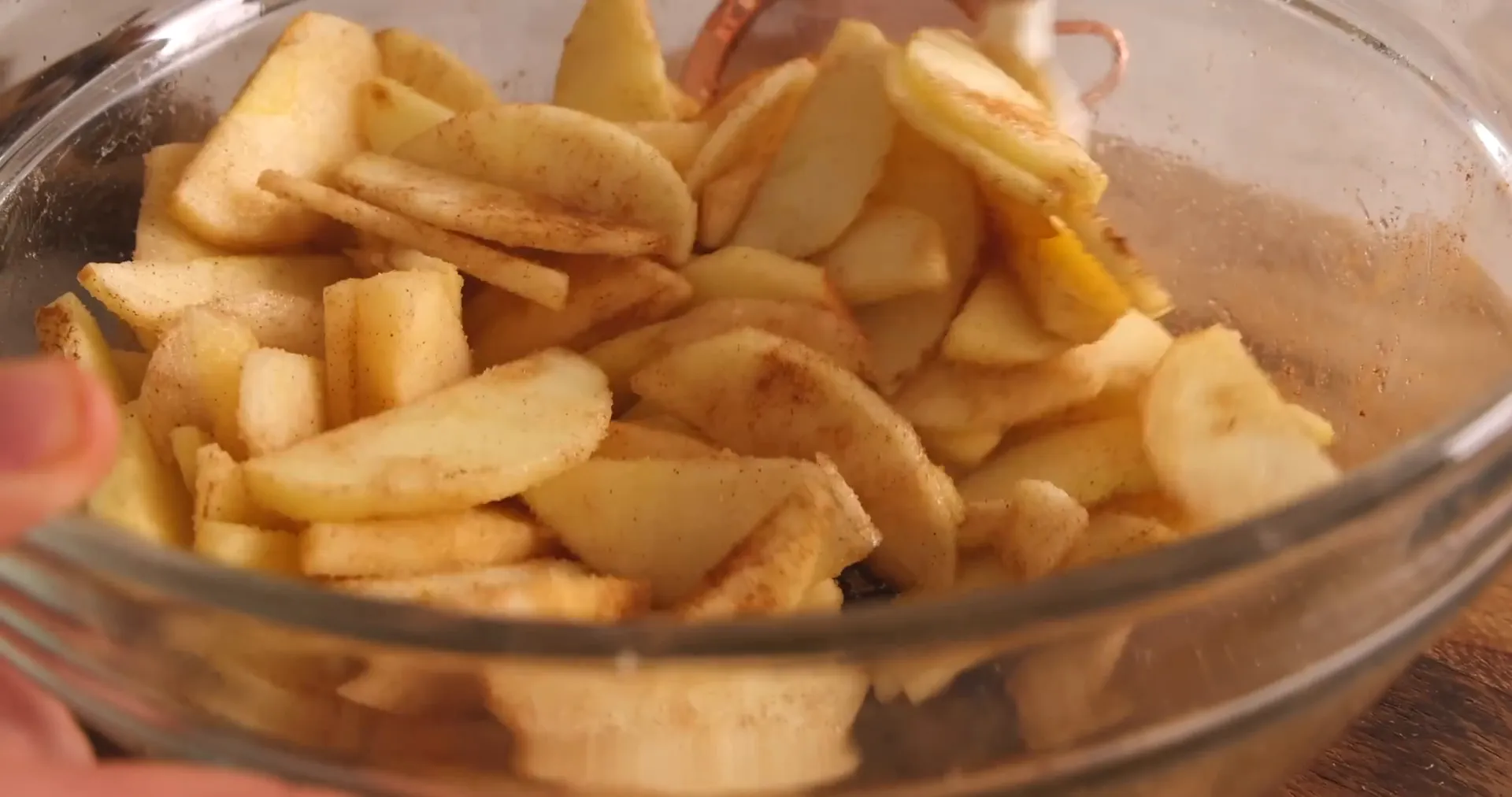 Sliced apples tossed with lemon juice, sugar, and cinnamon