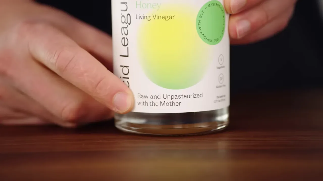 Labelled bottle of raw unpasteurized living vinegar showing the 'with the mother' text