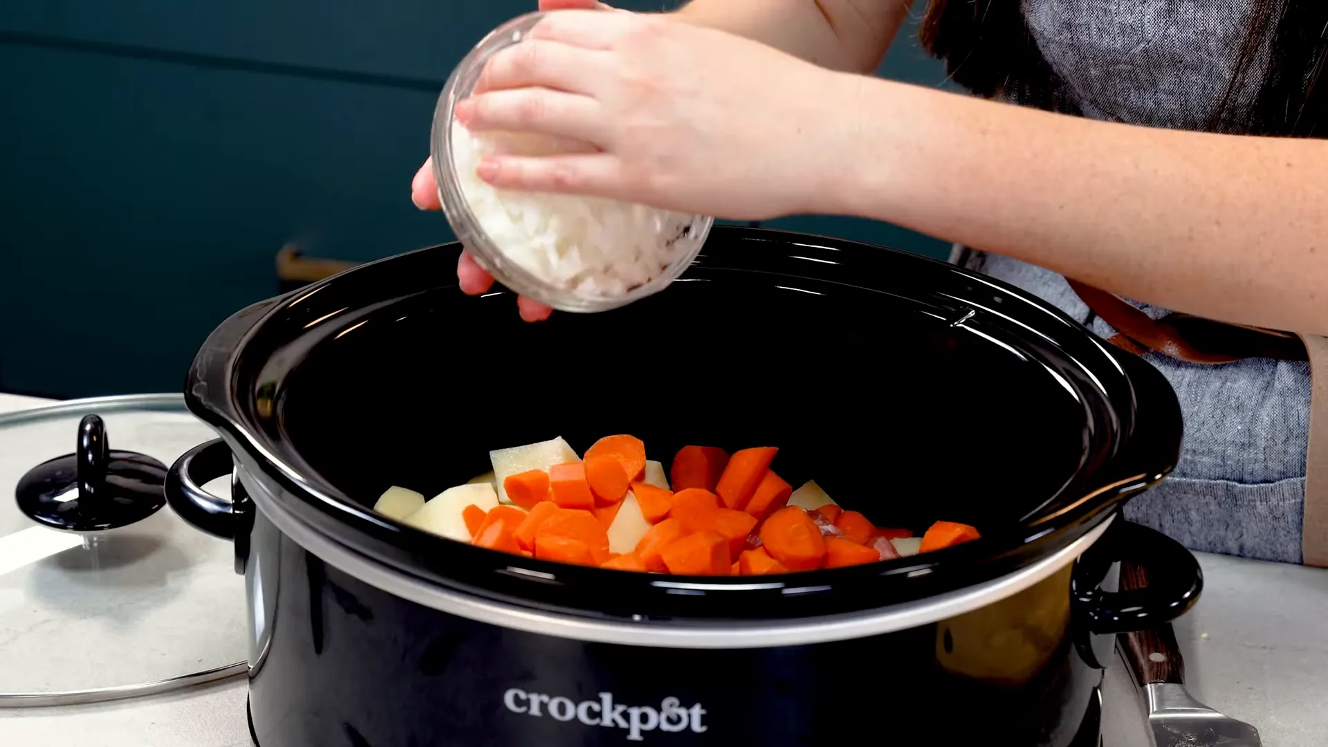 Chopped potatoes, carrots, and onion ready for the slow cooker