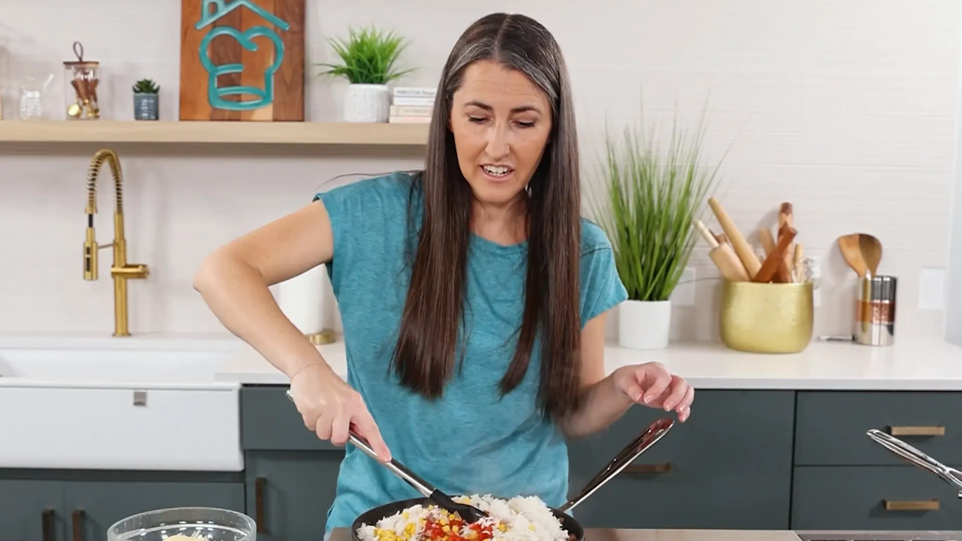 Mixing filling ingredients including rice, corn, and cheese