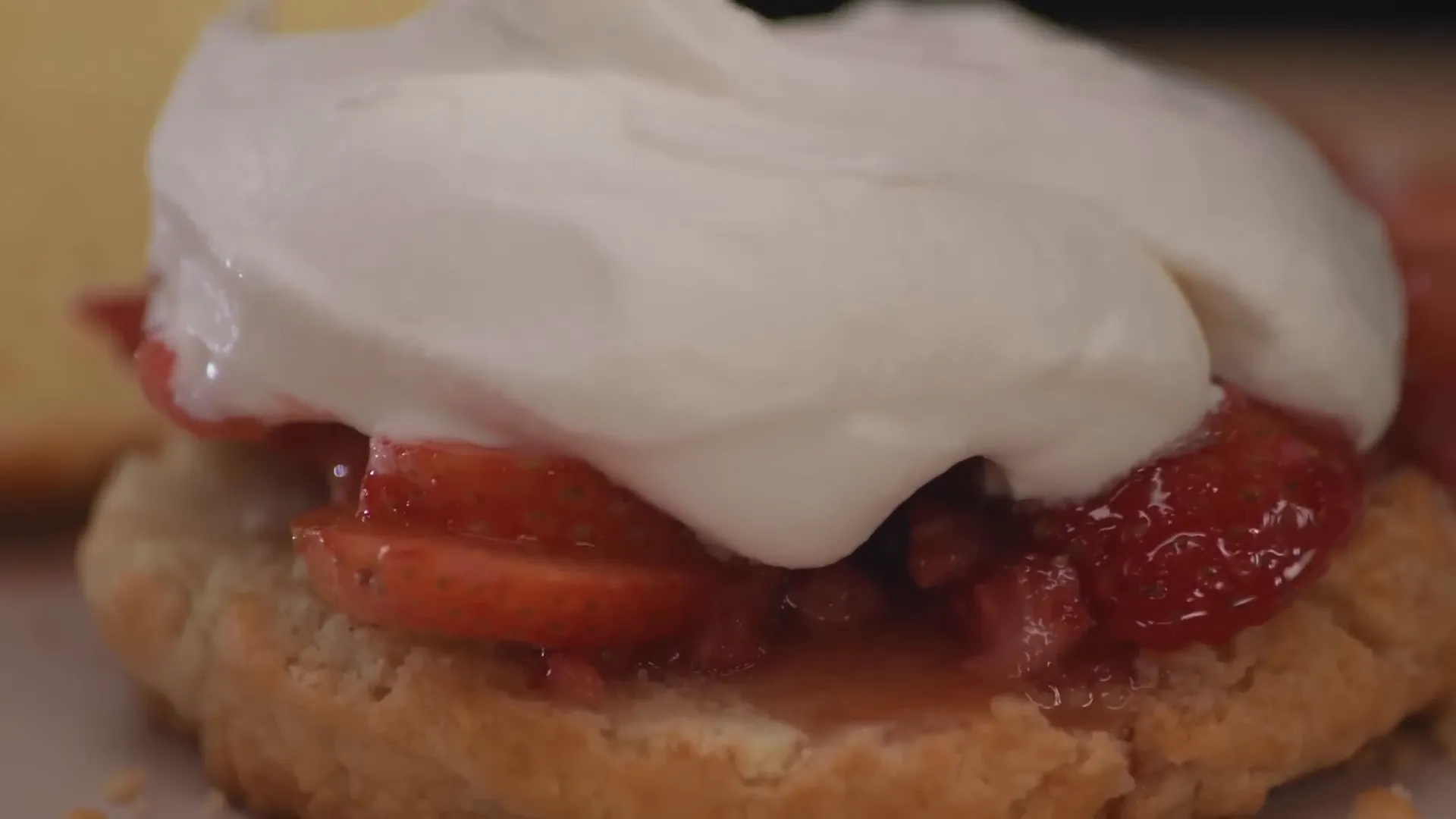 Assembled strawberry shortcake with juicy strawberries and whipped cream