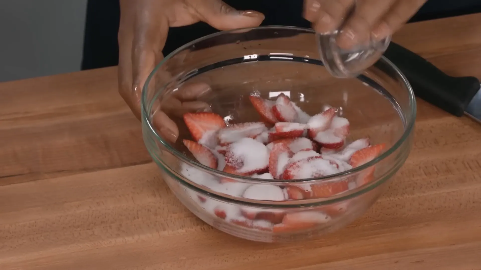 Sliced and mashed strawberries mixed with sugar