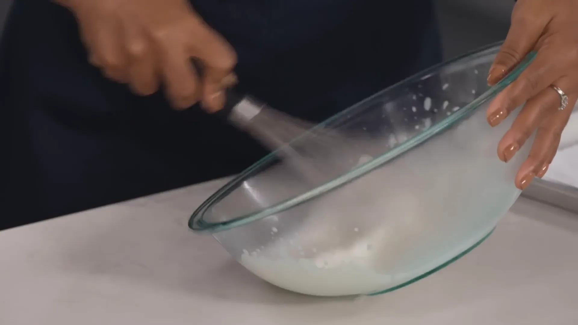 Whipping cream in a chilled bowl for perfect texture