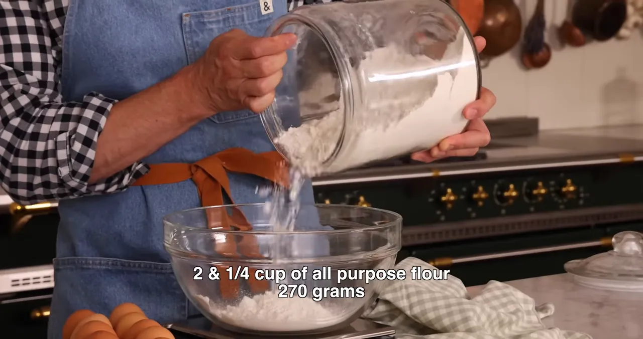 Measuring flour into a large bowl