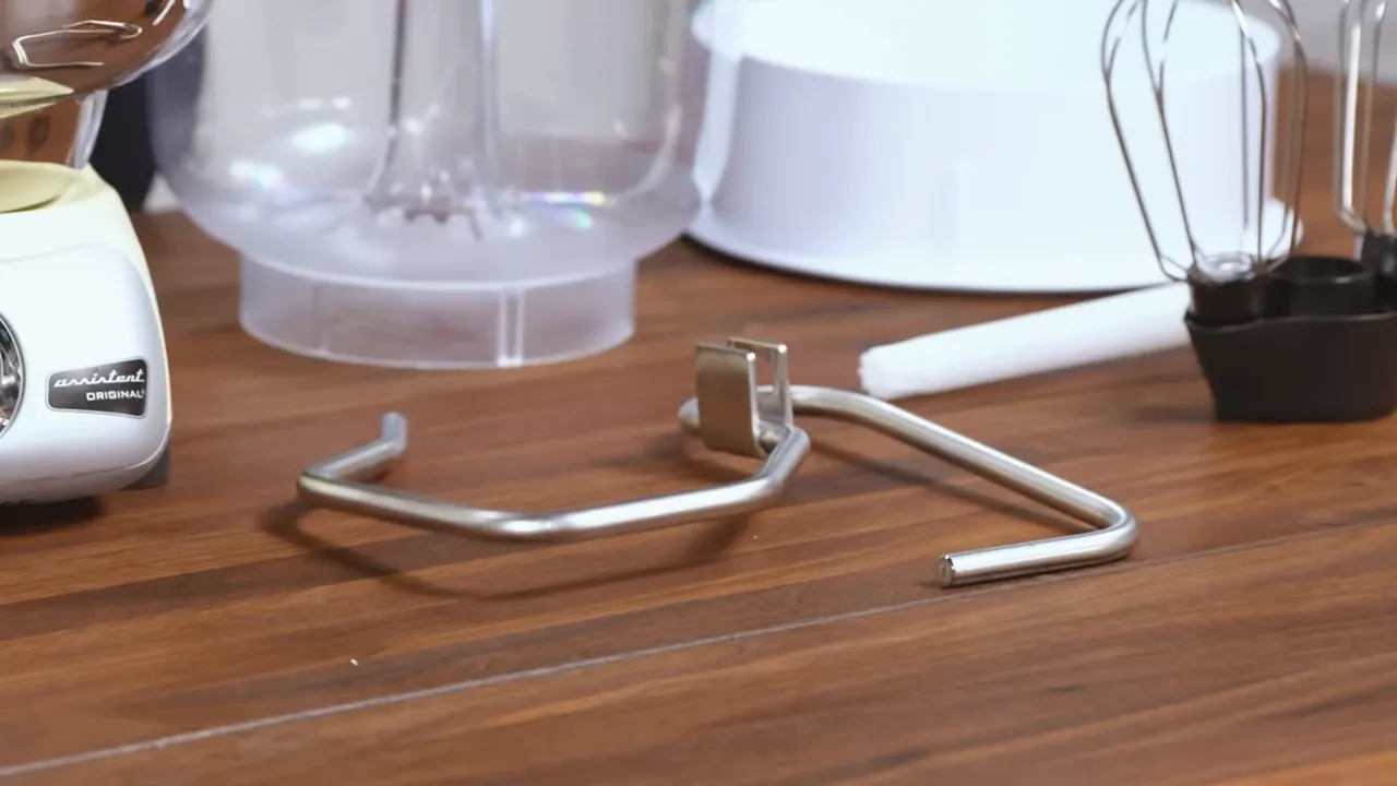 Assortment of Ankarsrum bowls, rollers, and whisks laid out