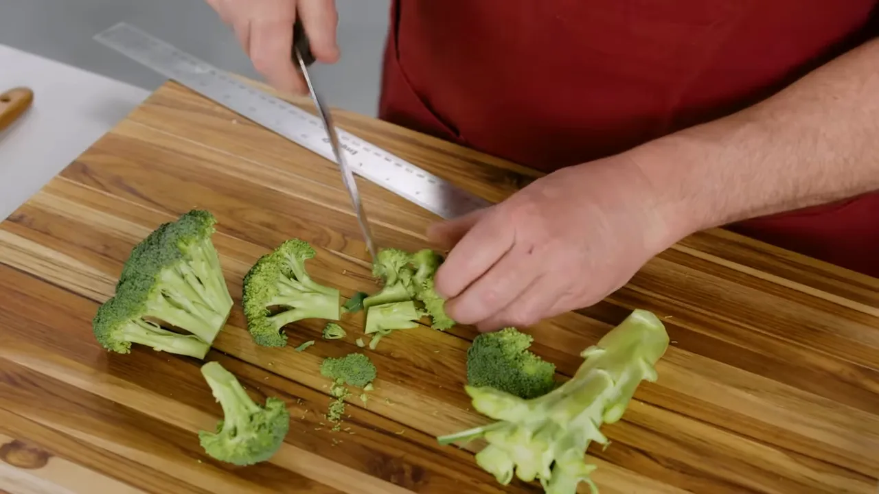 Cut broccoli floret sized to one inch next to a ruler as reference