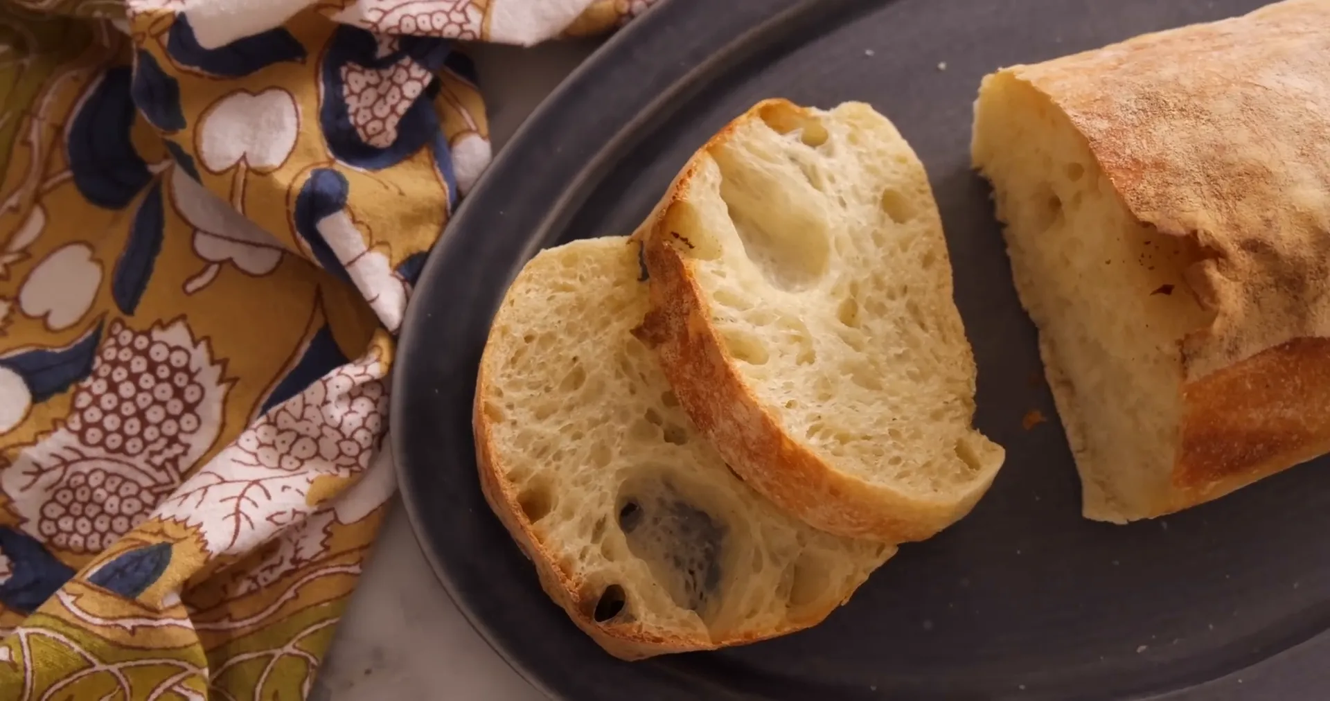 Sliced ciabatta showing airy crumb and crust