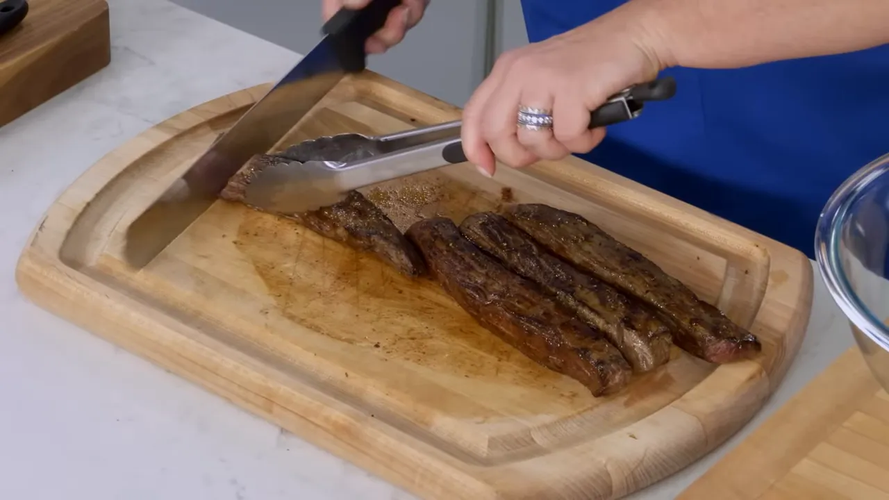 Sliced medium rare flank steak ready for tacos