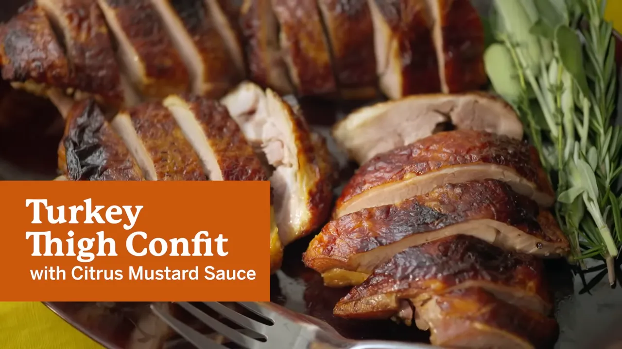 Turkey thighs curing in a tray with onion and thyme