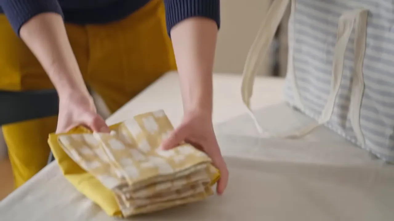 Tablescape with mixed napkins, flowers, and layered place settings
