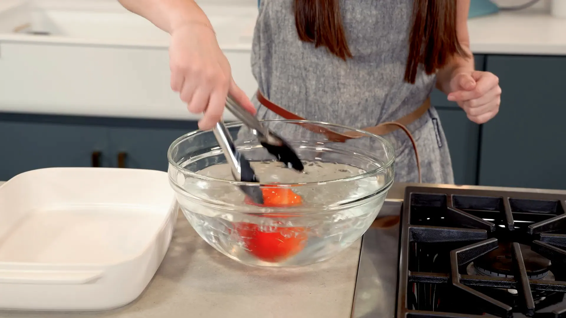 Peach being shocked in boiling and ice water for easy peeling