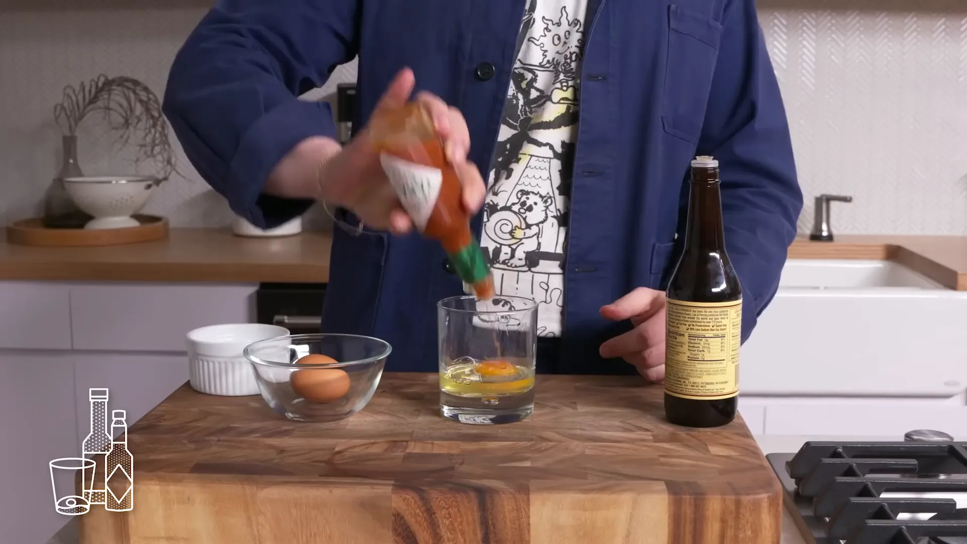Prairie oyster egg with condiments in a glass