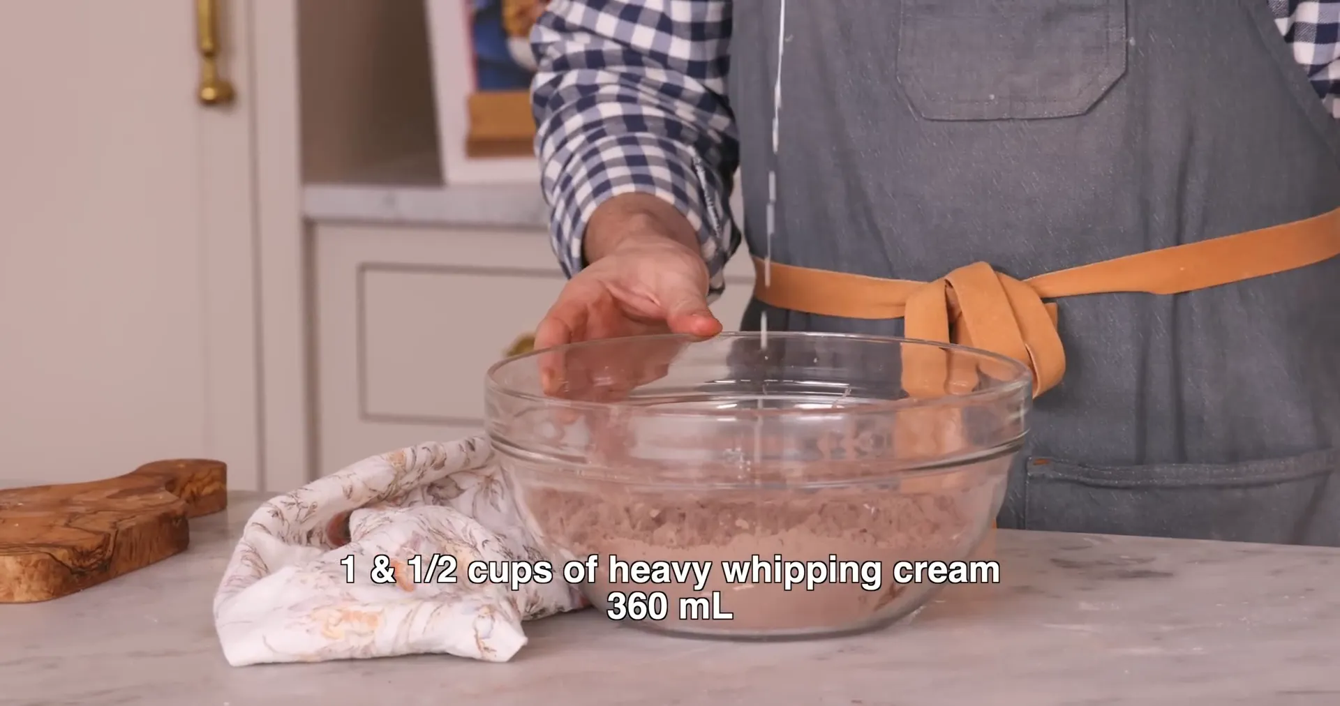 Mixing heavy cream into scone dough to form shaggy texture